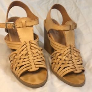 Tan espadrilles with block heel.